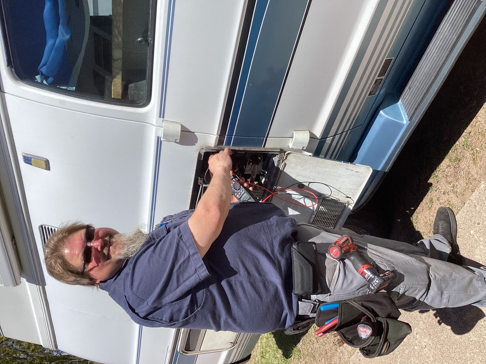 Steve diagnosing RV electrical with a multimeter